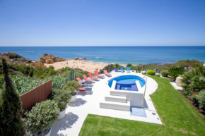 Отель Beachfront Villa de la Plage private pool and jacuzzi, private path beach  Албуфейра